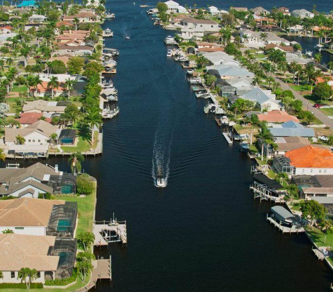 Aerial shot of Cape Coral, Florida on a sunny day in spring. Cape Coral is a coastal city in Florida known as the Venice of America.

Authorization was obtained from the FAA for this operation in restricted airspace.